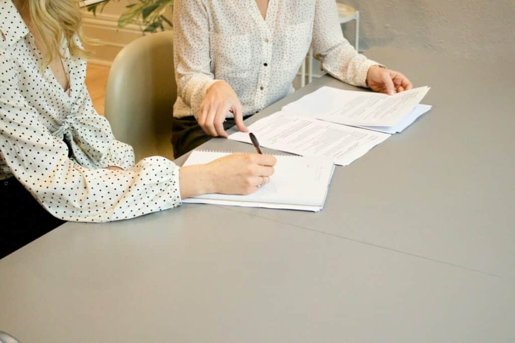 Woman consulting in signing papers