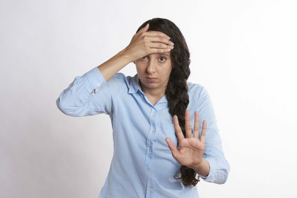 Woman showing a stop hand gesture